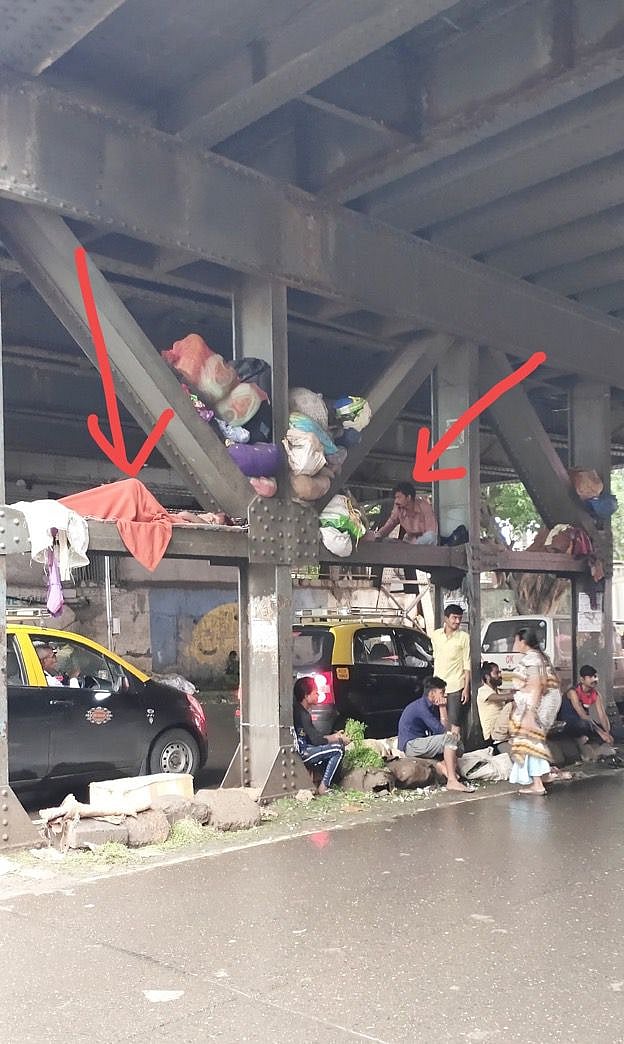 Hawkers use the columns of the Tilak bridge as their storage 